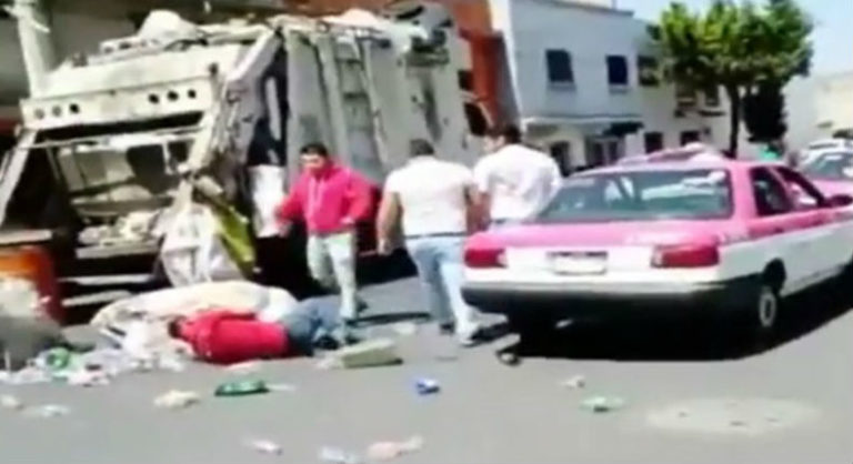 taxistas golpean a recolector de basura